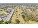 Expansive aerial view overlooking community apartments and the lush golf course and winding lake at 2310 Denmark St # 30, Clearwater, FL 33763