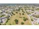 Community aerial view of well-maintained golf course and surrounding condominiums and lush foliage at 2310 Denmark St # 30, Clearwater, FL 33763