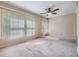 Bedroom featuring ceiling fan, neutral walls and carpet flooring at 2310 Denmark St # 30, Clearwater, FL 33763