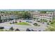 View of the building showcasing manicured lawns, ample parking, and elegant architectural details at 2310 Denmark St # 30, Clearwater, FL 33763