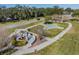 Scenic community grounds with a decorative fountain, inviting walking paths, and meticulously landscaped areas at 2310 Denmark St # 30, Clearwater, FL 33763