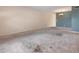 Neutral living area with a chandelier, a doorway to an adjacent room, and a blue accent wall at 2310 Denmark St # 30, Clearwater, FL 33763