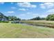 This property has a beautiful, large pond in the backyard, with lush, green Florida vegetation at 2313 Grenoble Pl # 2313, Sun City Center, FL 33573