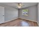 Bedroom with modern wood-look flooring and view from the window at 2313 Grenoble Pl # 2313, Sun City Center, FL 33573