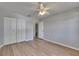 Bedroom with ample closet space and modern wood-look flooring at 2313 Grenoble Pl # 2313, Sun City Center, FL 33573