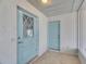 Charming entryway showcasing a decorative glass door and a separate storage closet at 2313 Grenoble Pl # 2313, Sun City Center, FL 33573