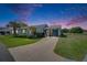 Inviting single-story home featuring meticulous landscaping and a convenient covered carport at 2313 Grenoble Pl # 2313, Sun City Center, FL 33573