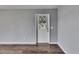 Neutral room showcasing durable vinyl floors and a charming glass paneled door at 2313 Grenoble Pl # 2313, Sun City Center, FL 33573