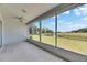 Screened lanai providing expansive view of the lush backyard and pond at 2313 Grenoble Pl # 2313, Sun City Center, FL 33573