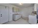 Functional laundry room equipped with storage cabinets and a washer/dryer set at 2313 Grenoble Pl # 2313, Sun City Center, FL 33573