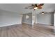 Spacious living area showcases hardwood floors and neutral gray paint, creating an inviting atmosphere at 2313 Grenoble Pl # 2313, Sun City Center, FL 33573