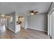Spacious living room is open to kitchen and has hardwood floors and sliding door to outdoor space at 2313 Grenoble Pl # 2313, Sun City Center, FL 33573