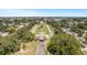 Grand entrance to a community featuring a beautiful archway, manicured lawns, and a central fountain at 2458 Columbia Dr E # 84, Clearwater, FL 33763