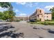 Spacious condo with well-manicured lawns and ample parking, set against a clear blue sky at 2458 Columbia Dr E # 84, Clearwater, FL 33763