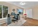 A home office features a large window for natural light, neutral walls, and wood floors with a shag rug at 2458 Columbia Dr E # 84, Clearwater, FL 33763