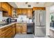 A well-equipped kitchen featuring stainless steel refrigerator and modern appliances at 2458 Columbia Dr E # 84, Clearwater, FL 33763