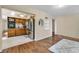 An open kitchen features stainless appliances, wood cabinetry, tile floor, and an eat-in area with lots of light at 2458 Columbia Dr E # 84, Clearwater, FL 33763