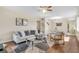 Cozy living room with dining area featuring modern furnishings and beautiful hard wood floors at 2458 Columbia Dr E # 84, Clearwater, FL 33763