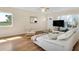 Bright living room with hard wood floors, modern furnishings, and ample natural light at 2458 Columbia Dr E # 84, Clearwater, FL 33763