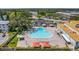 Inviting community pool with lounge chairs and umbrellas, perfect for relaxation and recreation at 2458 Columbia Dr E # 84, Clearwater, FL 33763