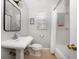 Updated bathroom with a sink, toilet, and shower-tub combination at 246 20Th Ne Ave, St Petersburg, FL 33704