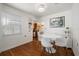 Bright dining room with hardwood floors, white table, and view to the kitchen and backyard at 246 20Th Ne Ave, St Petersburg, FL 33704