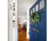Inviting blue front door with wreath, gold hardware, and house number 246 at 246 20Th Ne Ave, St Petersburg, FL 33704