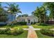 Charming single-story home with a beautifully landscaped front yard and inviting walkway at 246 20Th Ne Ave, St Petersburg, FL 33704