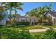 Inviting single-story home with vibrant landscaping and a well-maintained front yard at 246 20Th Ne Ave, St Petersburg, FL 33704