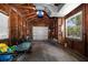 Spacious garage features wooden paneled walls and a modern white door at 246 20Th Ne Ave, St Petersburg, FL 33704