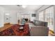 Bright living room with hardwood floors, a patterned rug, and modern furniture at 246 20Th Ne Ave, St Petersburg, FL 33704