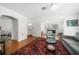 Bright living room featuring hardwood floors, neutral seating, and seamless transition to other rooms at 246 20Th Ne Ave, St Petersburg, FL 33704