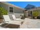 Tranquil patio area featuring lounge chairs and potted plants, offering a serene outdoor living space at 246 20Th Ne Ave, St Petersburg, FL 33704