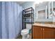 Well-lit bathroom with tile floors and granite vanity at 2574 Hidden Cove Ln, Clearwater, FL 33763
