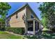 Rear exterior view of home with screened-in porch at 2574 Hidden Cove Ln, Clearwater, FL 33763