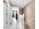 Bright hallway with white trim and neutral walls, leading to rooms and storage at 2574 Hidden Cove Ln, Clearwater, FL 33763