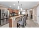 Modern kitchen featuring a breakfast bar, stainless steel appliances, and sleek countertops at 2574 Hidden Cove Ln, Clearwater, FL 33763