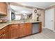 Modern kitchen with granite countertops, stainless steel appliances, and open layout at 2574 Hidden Cove Ln, Clearwater, FL 33763