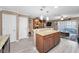 Open concept kitchen with granite countertops and modern lighting fixtures at 2574 Hidden Cove Ln, Clearwater, FL 33763