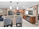 Kitchen with seating at the counter, stainless appliances and updated fixtures at 2574 Hidden Cove Ln, Clearwater, FL 33763