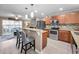 Modern kitchen featuring a breakfast bar, stainless steel appliances, and sleek countertops at 2574 Hidden Cove Ln, Clearwater, FL 33763
