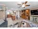 Open concept living room and kitchen with a large entertainment center at 2574 Hidden Cove Ln, Clearwater, FL 33763