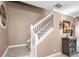 Bright staircase features white railing, neutral walls, and modern flooring leading upstairs at 2574 Hidden Cove Ln, Clearwater, FL 33763