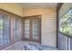 Outdoor balcony area with double french doors and plenty of space to relax in the sunshine at 2663 Sequoia Ter # 2663, Palm Harbor, FL 34683
