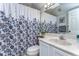 Bathroom featuring a vanity with sink and a shower with a floral curtain at 2663 Sequoia Ter # 2663, Palm Harbor, FL 34683