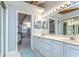 Elegant bathroom with double vanity, ample counter space, and a well-lit mirror at 2663 Sequoia Ter # 2663, Palm Harbor, FL 34683
