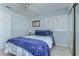 Comfortable bedroom with neutral walls, a ceiling fan, and window with wood blind offering natural light at 2663 Sequoia Ter # 2663, Palm Harbor, FL 34683