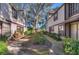 Charming townhome community featuring sidewalks, mature trees, and lush landscaping at 2663 Sequoia Ter # 2663, Palm Harbor, FL 34683