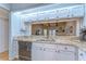 Bright kitchen with stone countertops looking into the living area at 2663 Sequoia Ter # 2663, Palm Harbor, FL 34683
