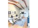 Cozy living room with exposed beams, hardwood floors, and stylish contemporary furniture at 2663 Sequoia Ter # 2663, Palm Harbor, FL 34683